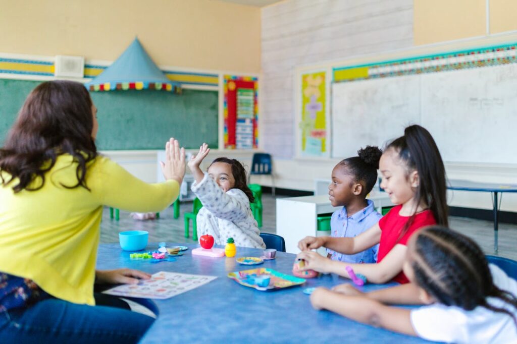 "Group of children engaging in collaborative play with a toy set, learning teamwork and social skills